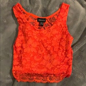 A bright orange/red Crop top.